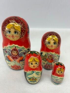 Handmade  and painted 5” to 2” set of four
wooden Russian nesting dolls